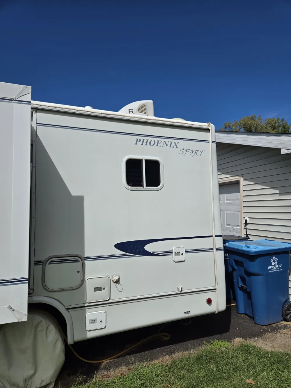 Motorhomes RV Park. Class B Motorcoaches Parking Closeup.